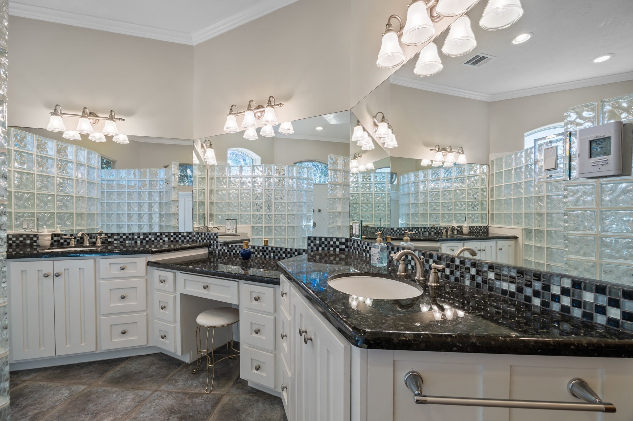 3998 County Road 612 Angleton, TX 77515 - Photo 24 of 47 a bathroom with a sink a chandelier and a mirror
