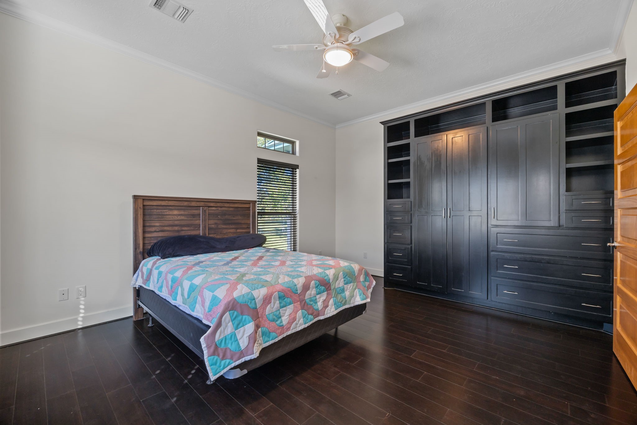 3998 County Road 612 Angleton, TX 77515 - Photo 28 of 47 a bedroom with a bed and wooden floor
