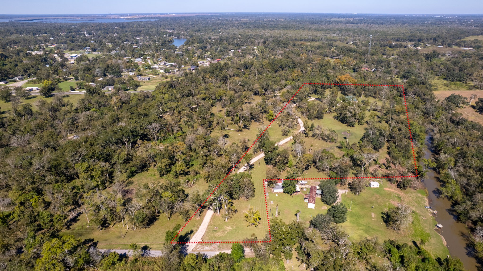 3998 County Road 612 Angleton, TX 77515 - Photo 41 of 47 an aerial view of a houses with a yard and mountain view