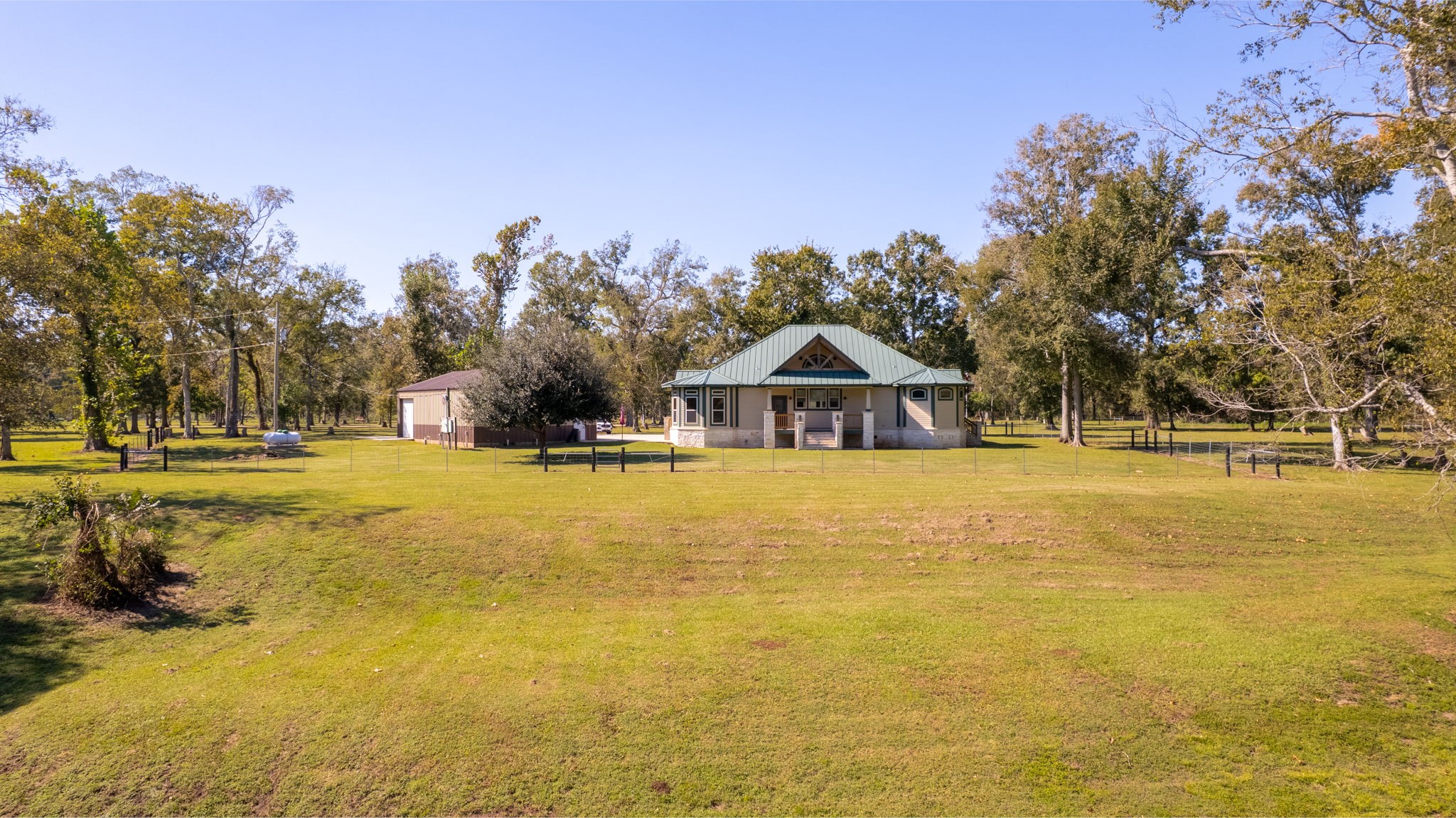 3998 County Road 612 Angleton, TX 77515 - Photo 44 of 47 a view of a swimming pool with an outdoor space and seating area