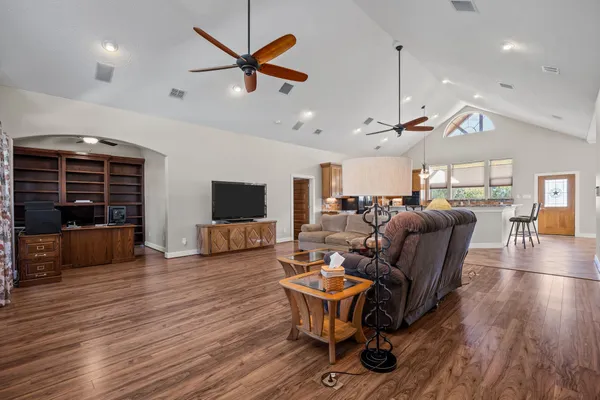 a view of workspace with wooden floor and windows