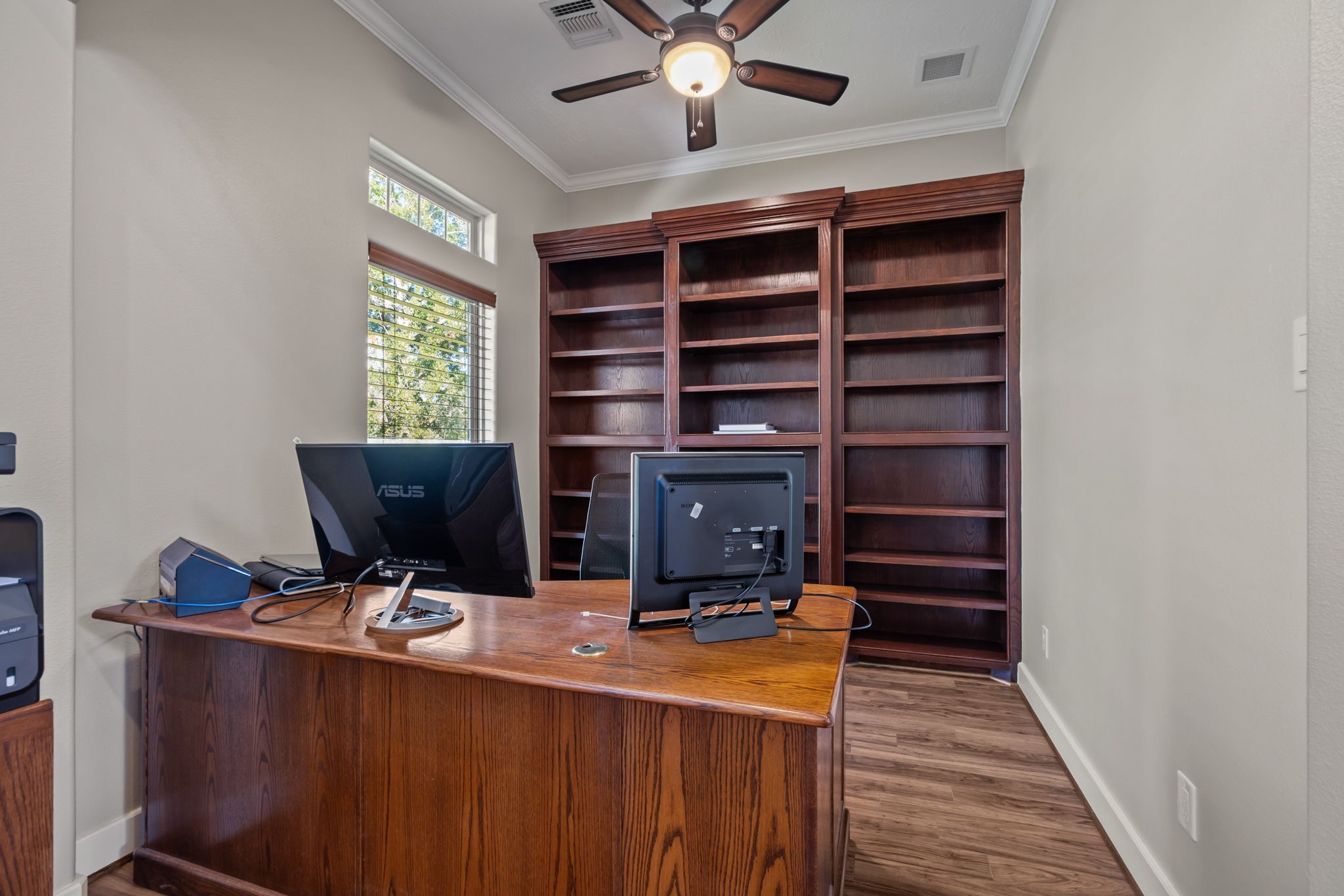 3998 County Road 612 Angleton, TX 77515 - Photo 10 of 47 a view of workspace with wooden floor and windows