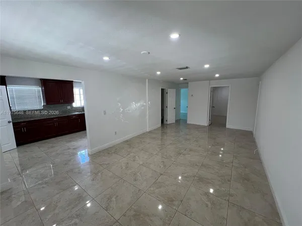 a view of an empty room with a window