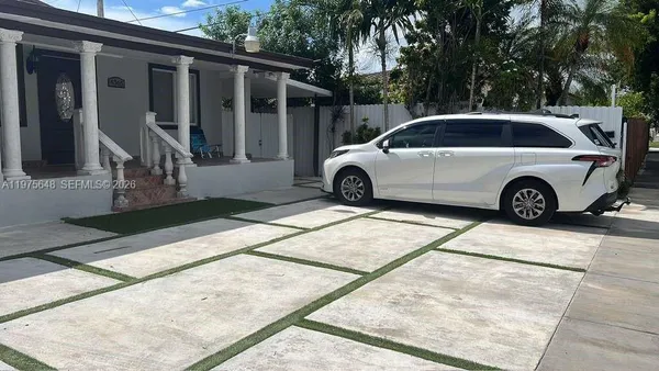 a view of a car parked in front of house
