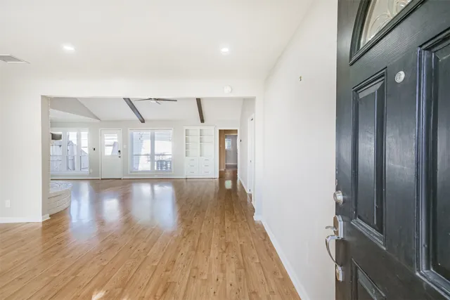 a view of gallery with wooden floor