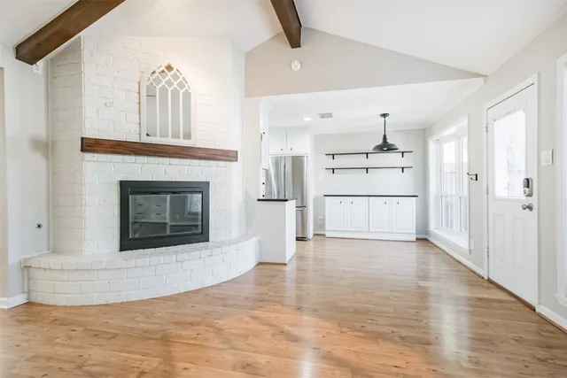 a view of a kitchen with a cabinet and a fireplace
