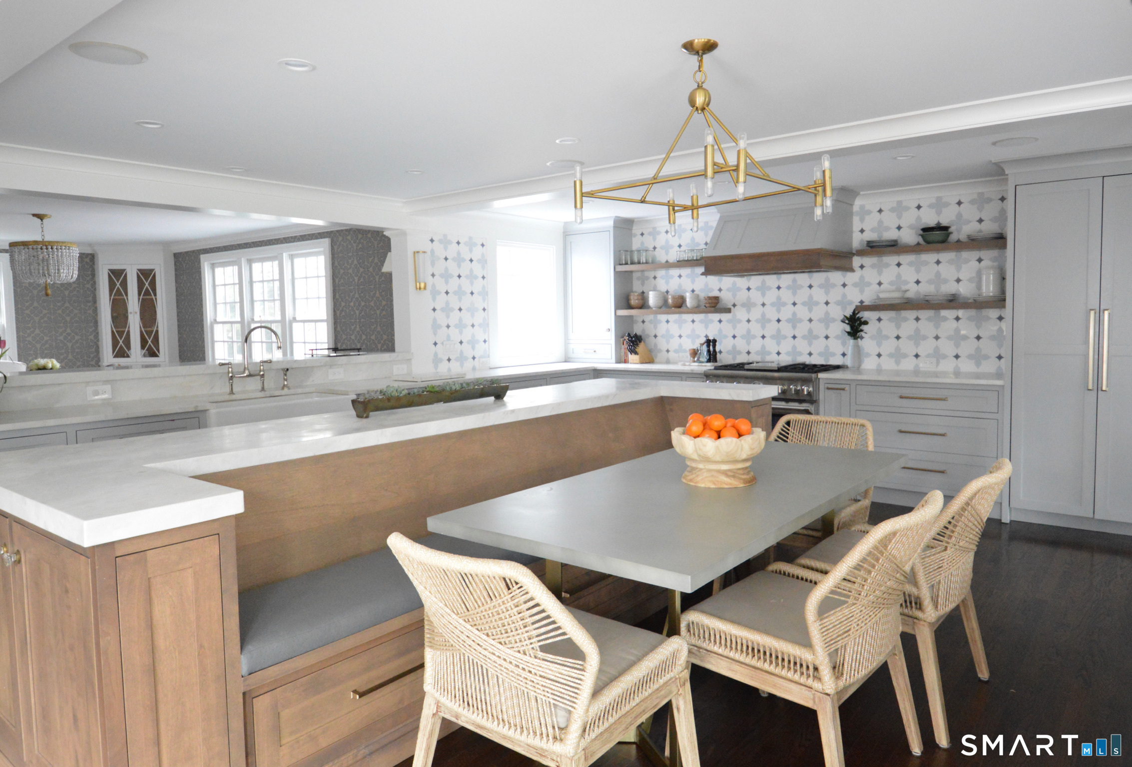142 Brookside Road Darien, CT 06820 - Photo 3 of 18 a kitchen with a table chairs and a counter top space