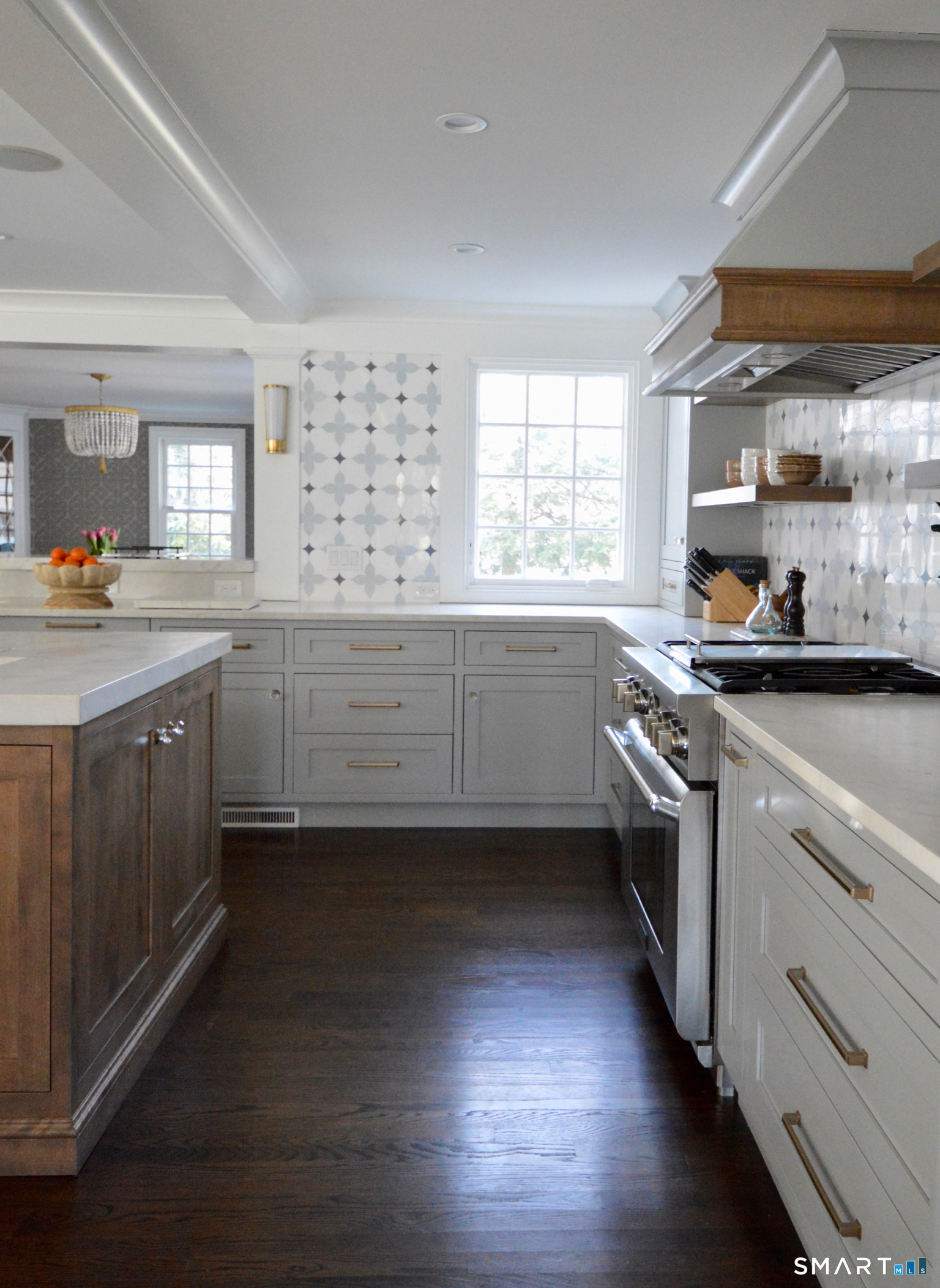 142 Brookside Road Darien, CT 06820 - Photo 5 of 18 a kitchen with granite countertop a sink a counter space appliances and cabinets