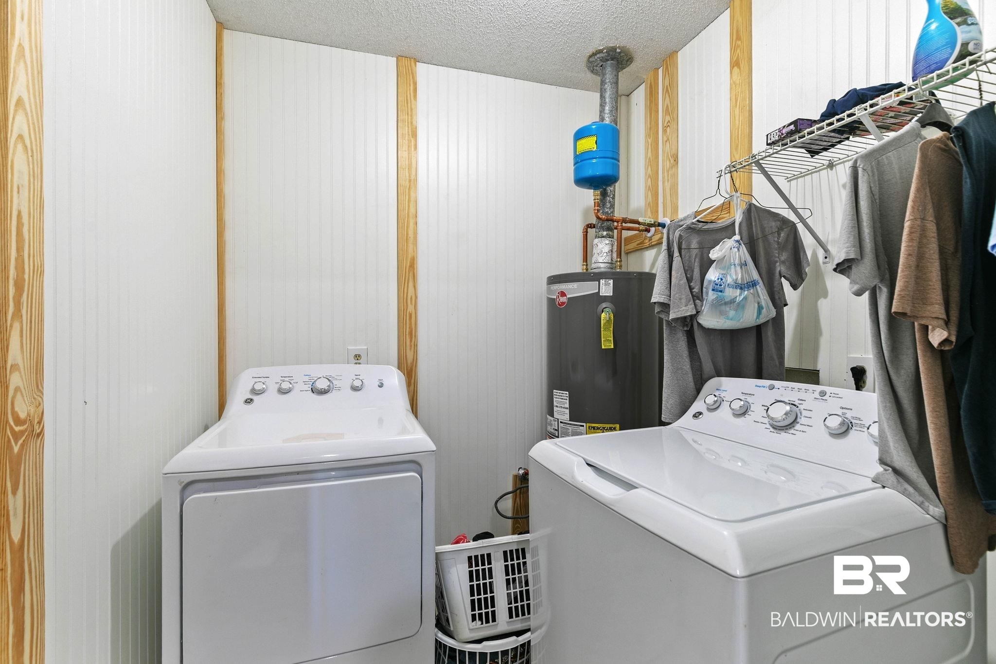 1510 South Juniper Street Foley, AL 36535 - Photo 27 of 36 Laundry area featuring washing machine and clothes dryer, a textured ceiling, and water heater