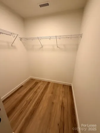 a view of a room with racks on the wall