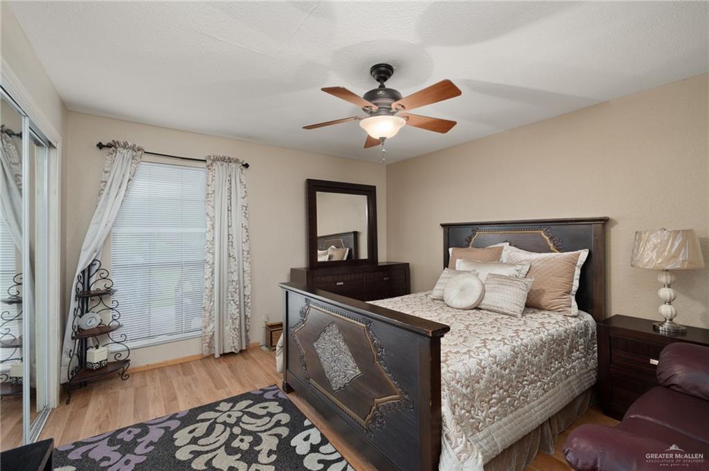 26813 Solis Road La Feria, TX 78559 - Photo 15 of 33 a bedroom with a bed and a walk in closet