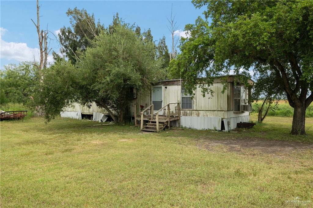 26813 Solis Road La Feria, TX 78559 - Photo 17 of 33 a view of a house with backyard and sitting area