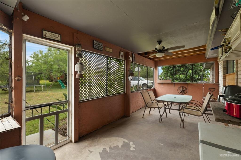26813 Solis Road La Feria, TX 78559 - Photo 18 of 33 a view of a porch with furniture and a yard