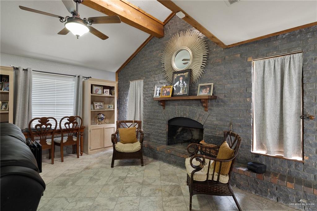 26813 Solis Road La Feria, TX 78559 - Photo 5 of 33 a living room with furniture and a fireplace