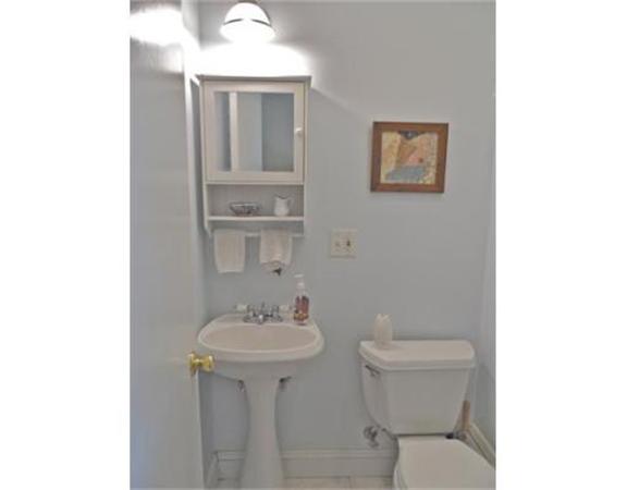 193 Abbott Street Springfield, MA 01118 - Photo 10 of 21 a bathroom with a sink toilet and a mirror