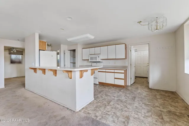 a view of storage and utility room with washer and dryer