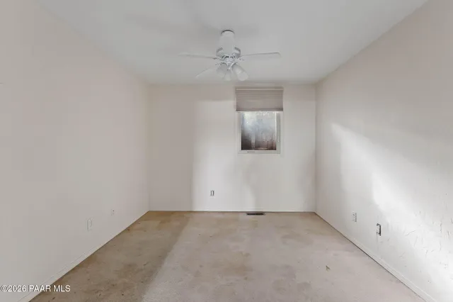 a view of kitchen with stainless steel appliances granite countertop cabinets and a refrigerator