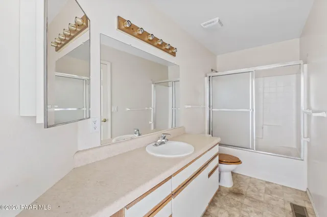 a view of a house with a yard covered with snow in front of house