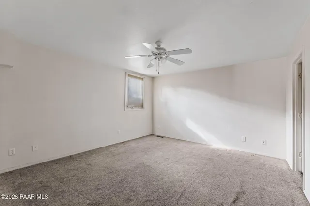 a view of a house with a yard and garage