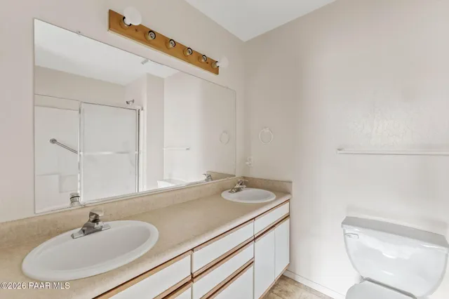 a view of a yard with plants and trees