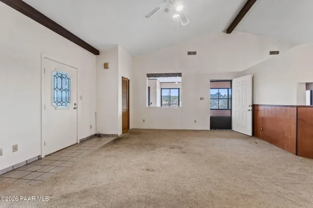 a bathroom with a refrigerator and cabinets