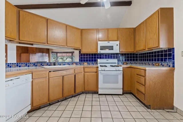 a bathroom with a granite countertop sink mirror bathtub and shower