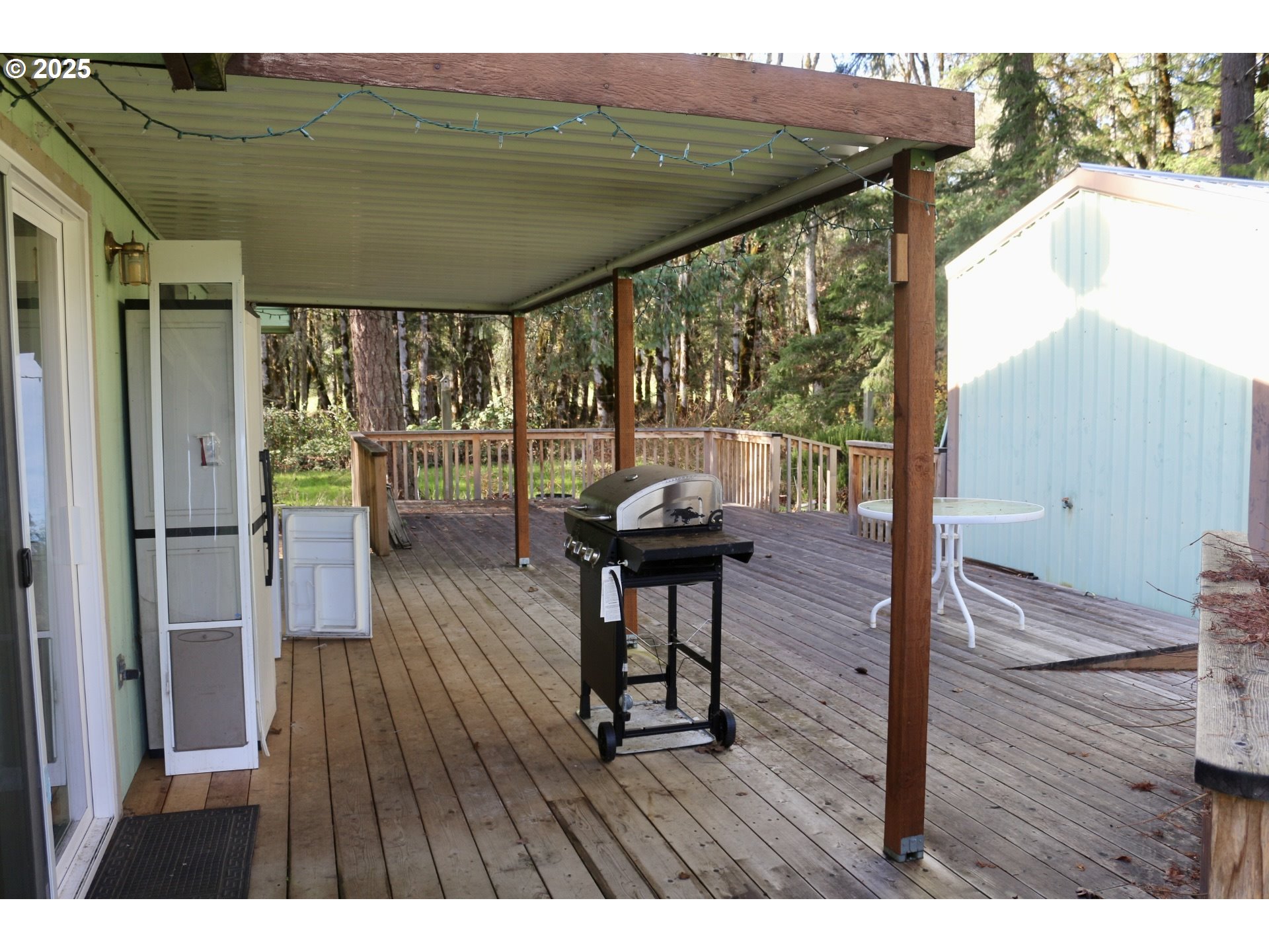 475 Thomas ( 471) Road Sutherlin, OR 97479 - Photo 3 of 43 a view of a balcony with furniture and wooden floor