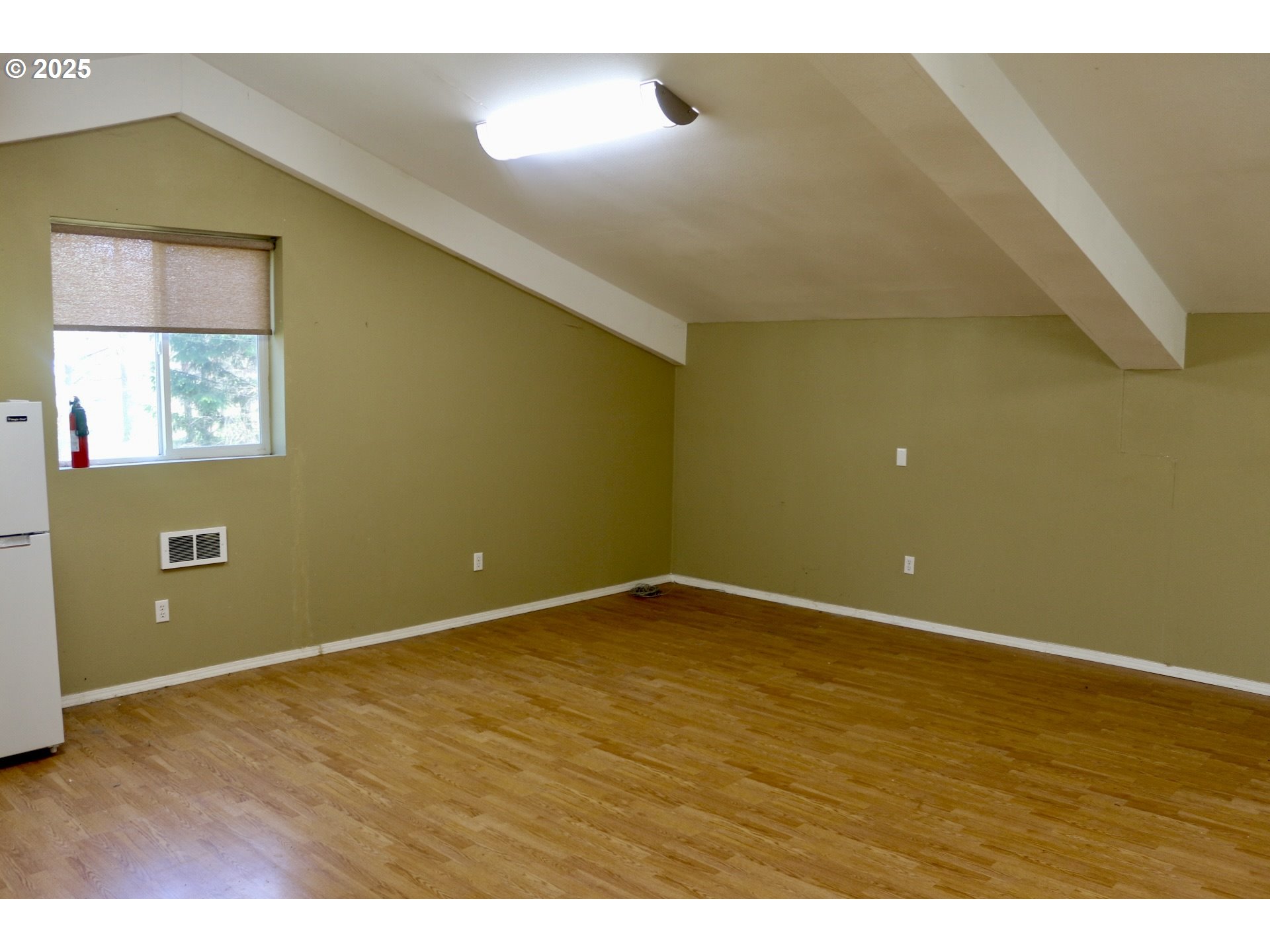 475 Thomas ( 471) Road Sutherlin, OR 97479 - Photo 36 of 43 a view of an empty room with wooden floor and window