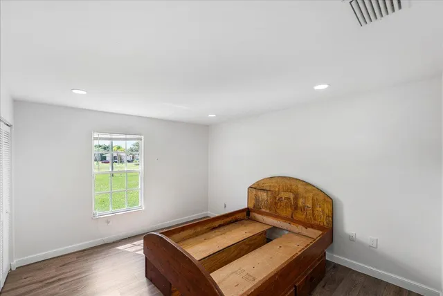 a room with a bed and a window