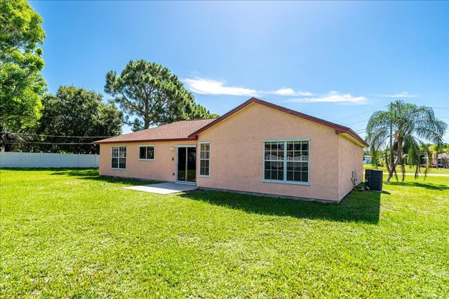 a house view with a backyard space