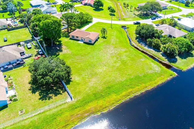 a view of a yard with swimming pool