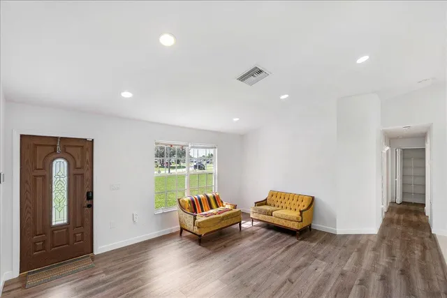 a living room with furniture and a window