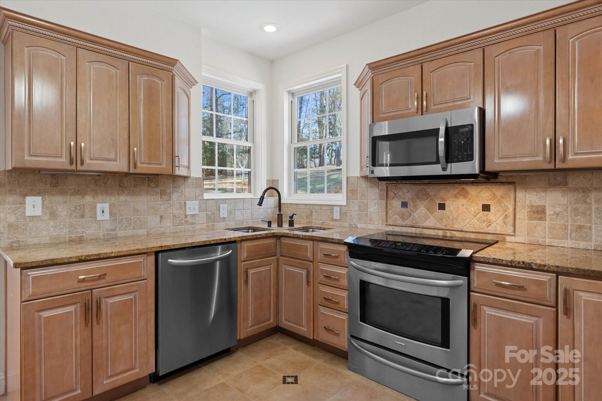 5774 Crown Terrace Hickory, NC 28601 - Photo 17 of 48 a kitchen with cabinets stainless steel appliances a sink and a window