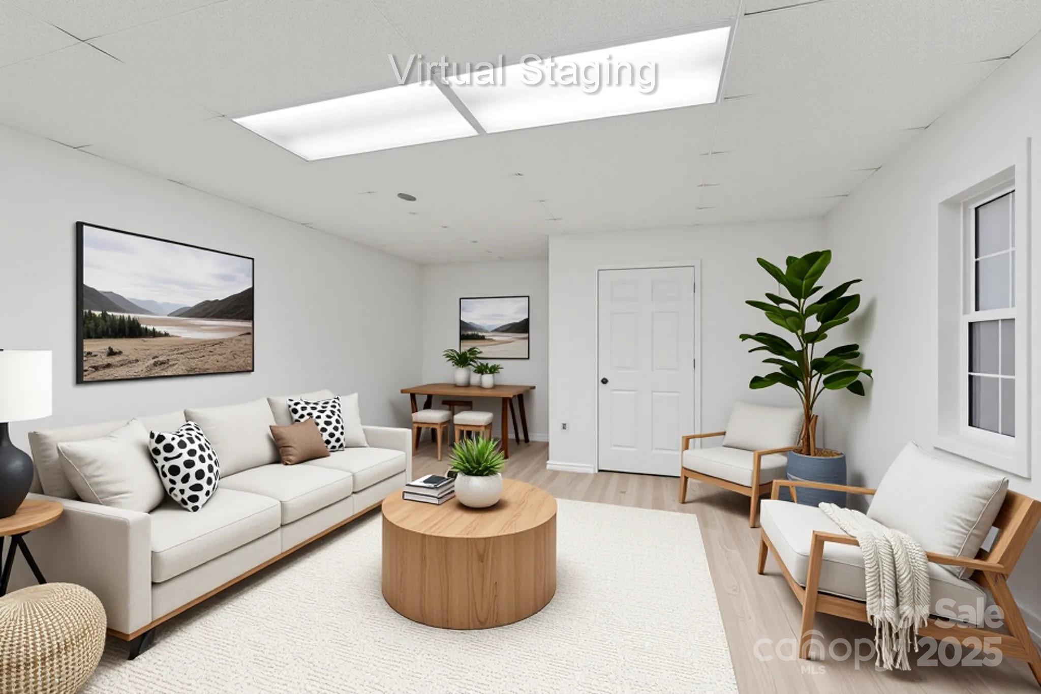 5774 Crown Terrace Hickory, NC 28601 - Photo 44 of 48 a living room with furniture and a potted plant