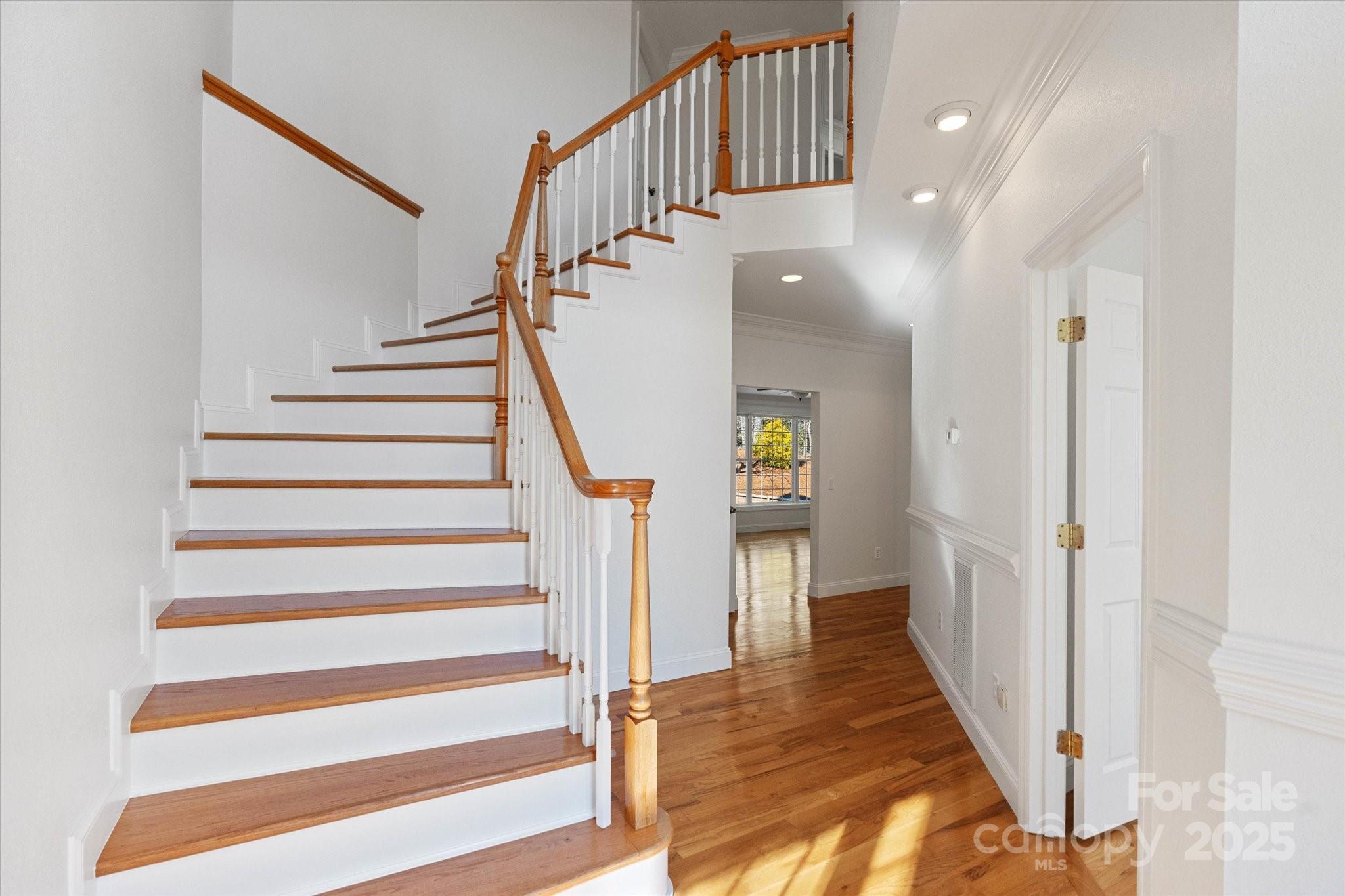5774 Crown Terrace Hickory, NC 28601 - Photo 10 of 48 a view of entryway and hall with wooden floor