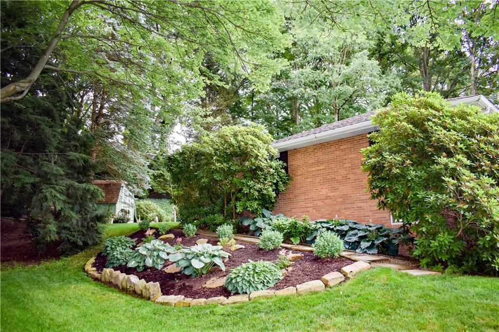 113 Morningside Drive Butler, PA 16002 - Photo 22 of 25 A view of the side of the all brick home, with lovingly created planters full of perennials that will come back year after year for your enjoyment.