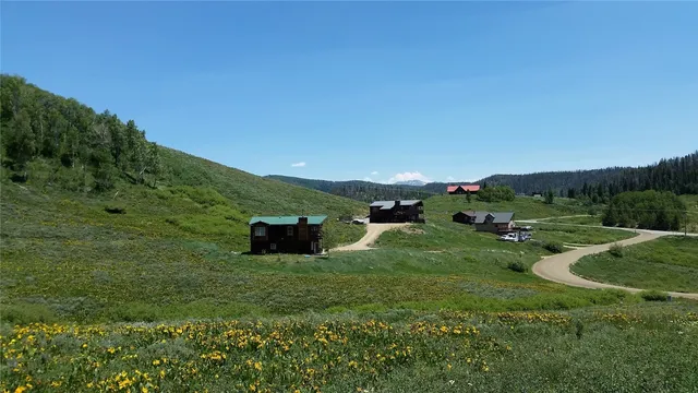 a view of a lake with boats and trees in the background