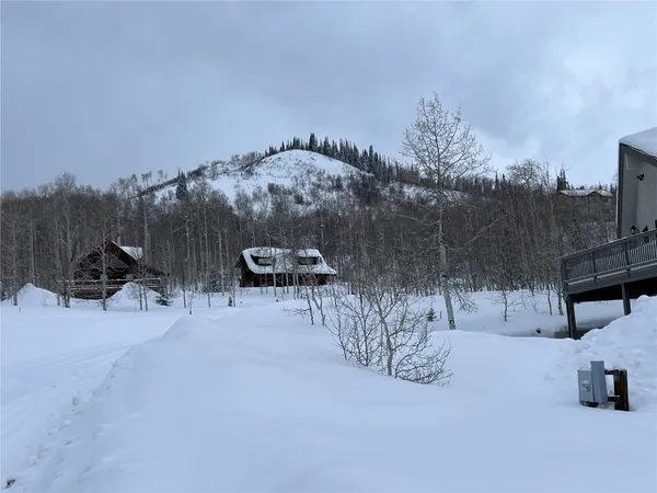 a view of a large body of water with a house in background