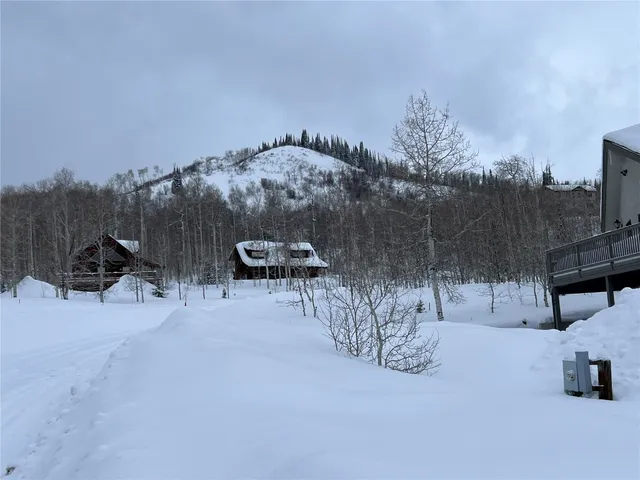 a view of a large body of water with a house in background