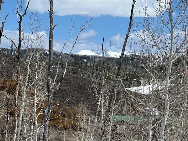 a view of a large body of water with a building in the background