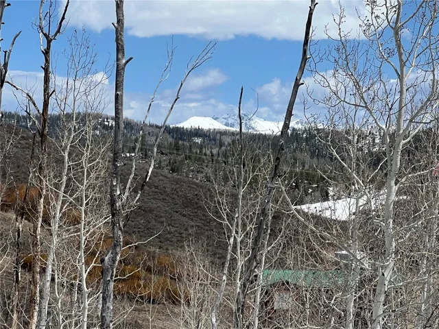 a view of a large body of water with a building in the background