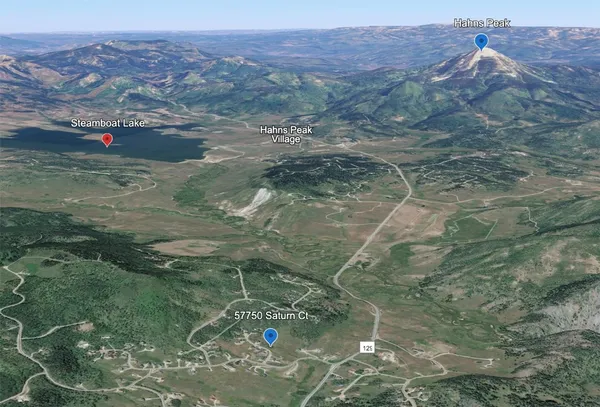 a view of a lake in a field