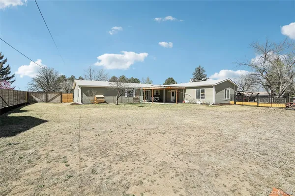 a view of a yard with large trees