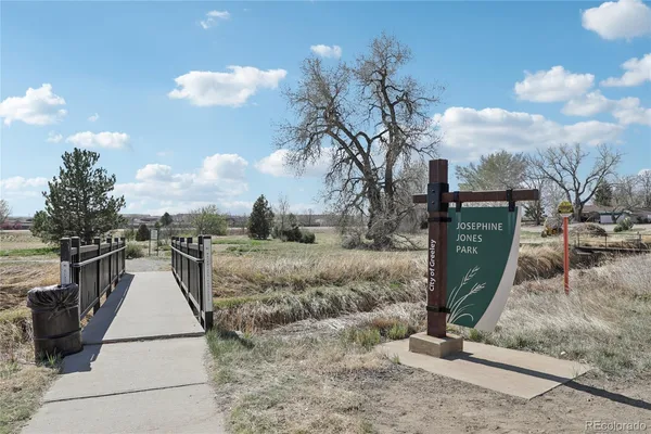 a view of swimming pool with a yard