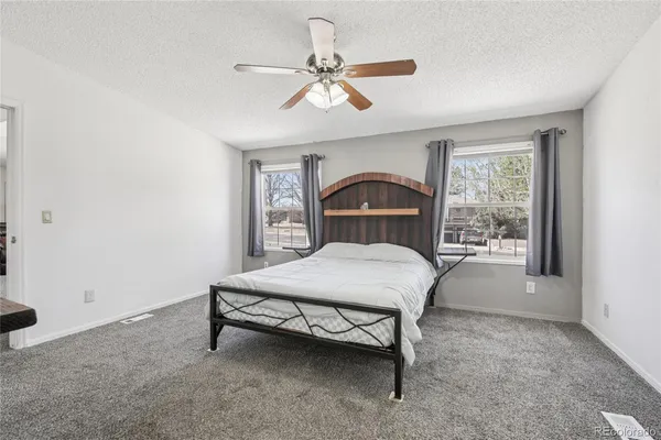 a view of washer and dryer with kitchen view