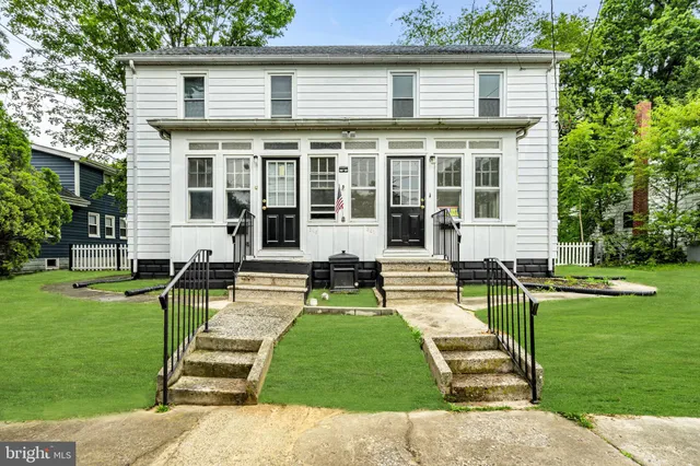 front view of a house with a yard