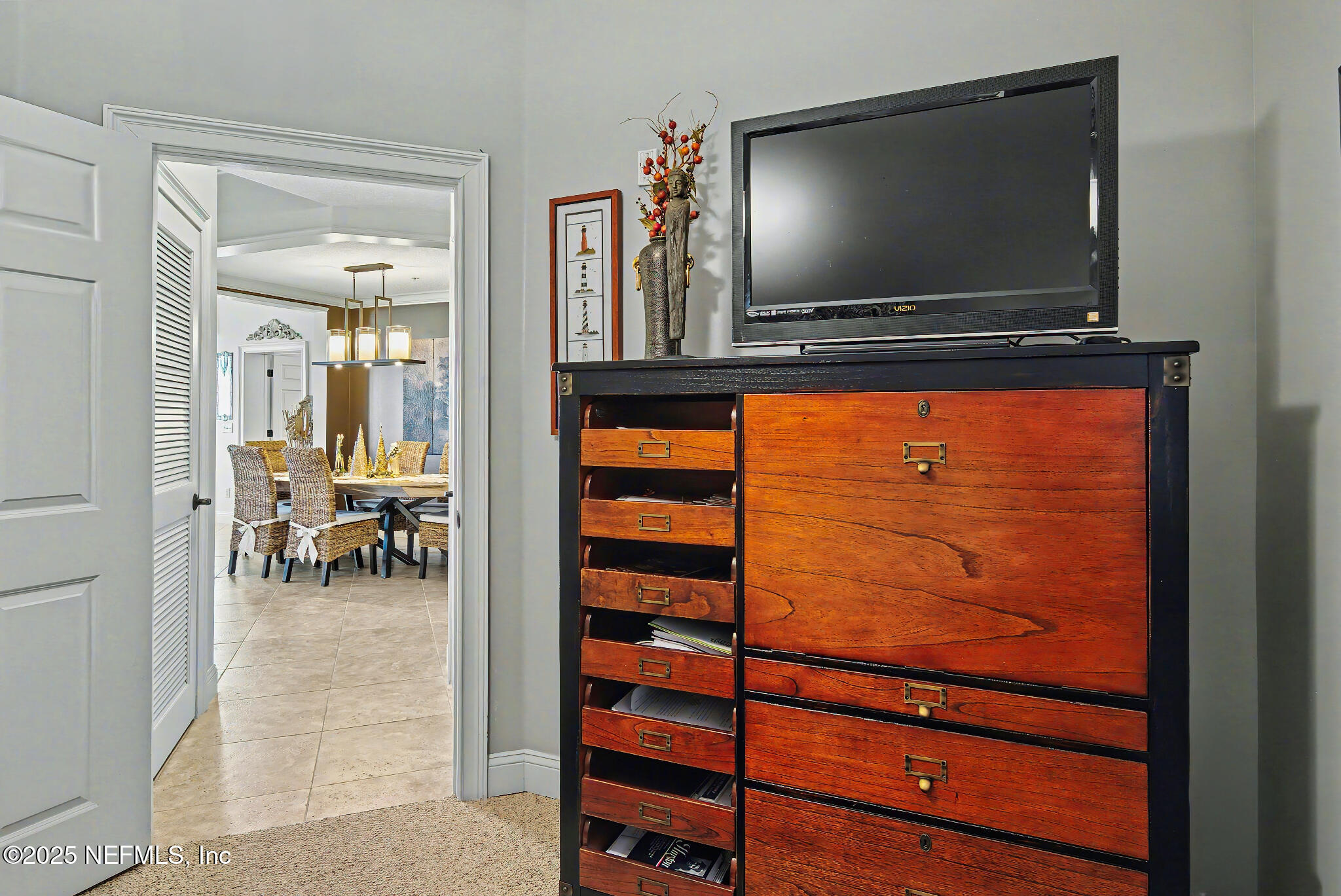 1 Radio Road, Unit 203 St. Augustine, FL 32084 - Photo 33 of 57 a living room with furniture and a flat screen tv