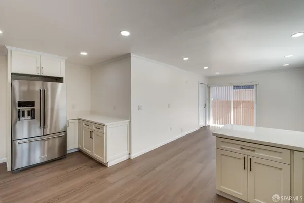 a dining room with furniture and wooden floor