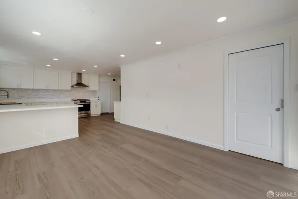 a view of room with wooden floor
