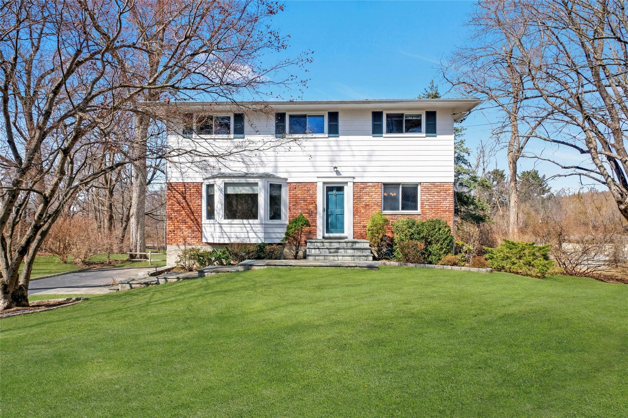 10 Redway Road Ossining, NY 10562 - Photo 1 of 1 Welcome to 10 Redway Road - featuring brick, wood siding and a level front yard in a quiet cul-de-sac